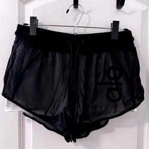 Alo yoga shorts with white spandex shorts underneath